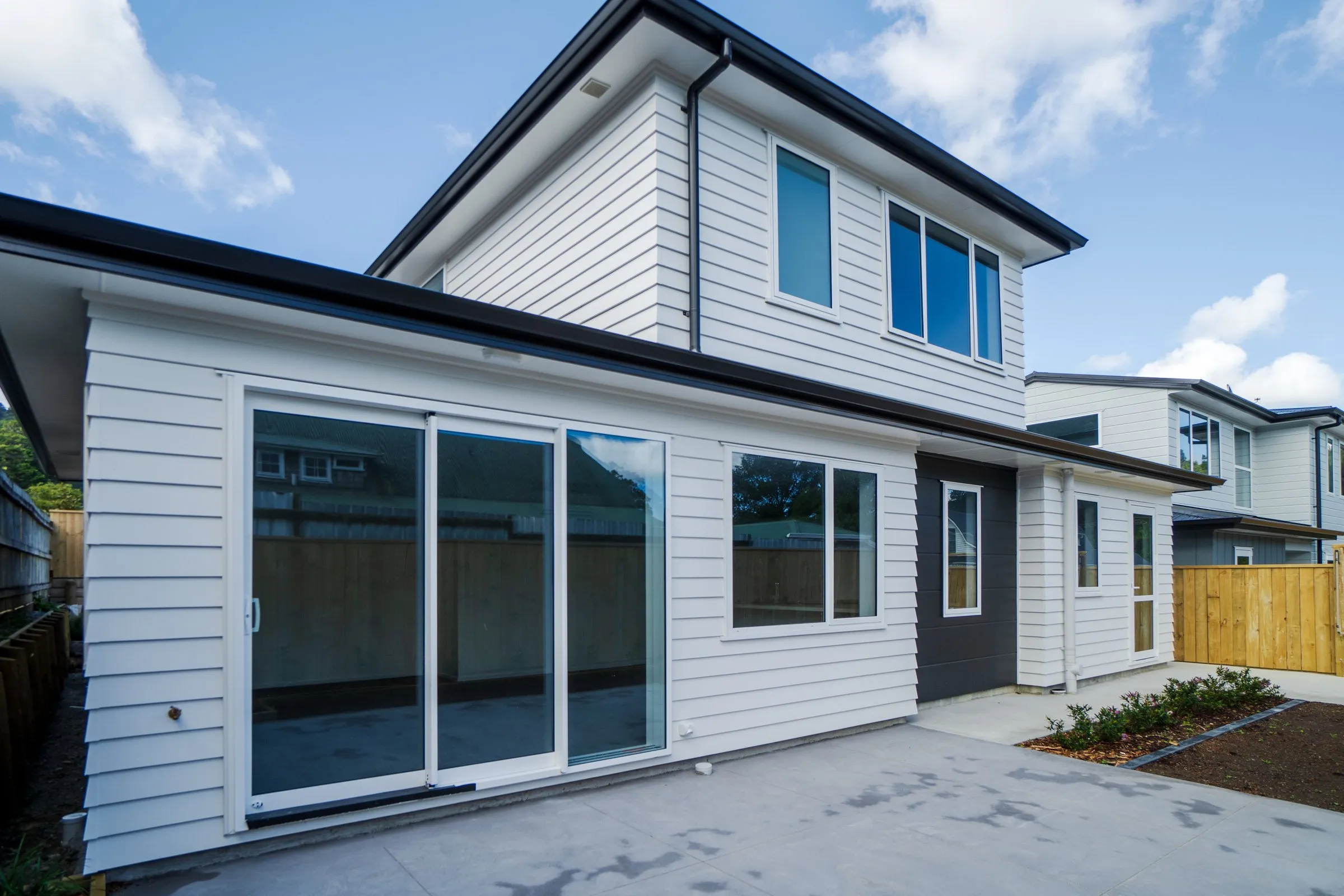 Two storey home with a lawn