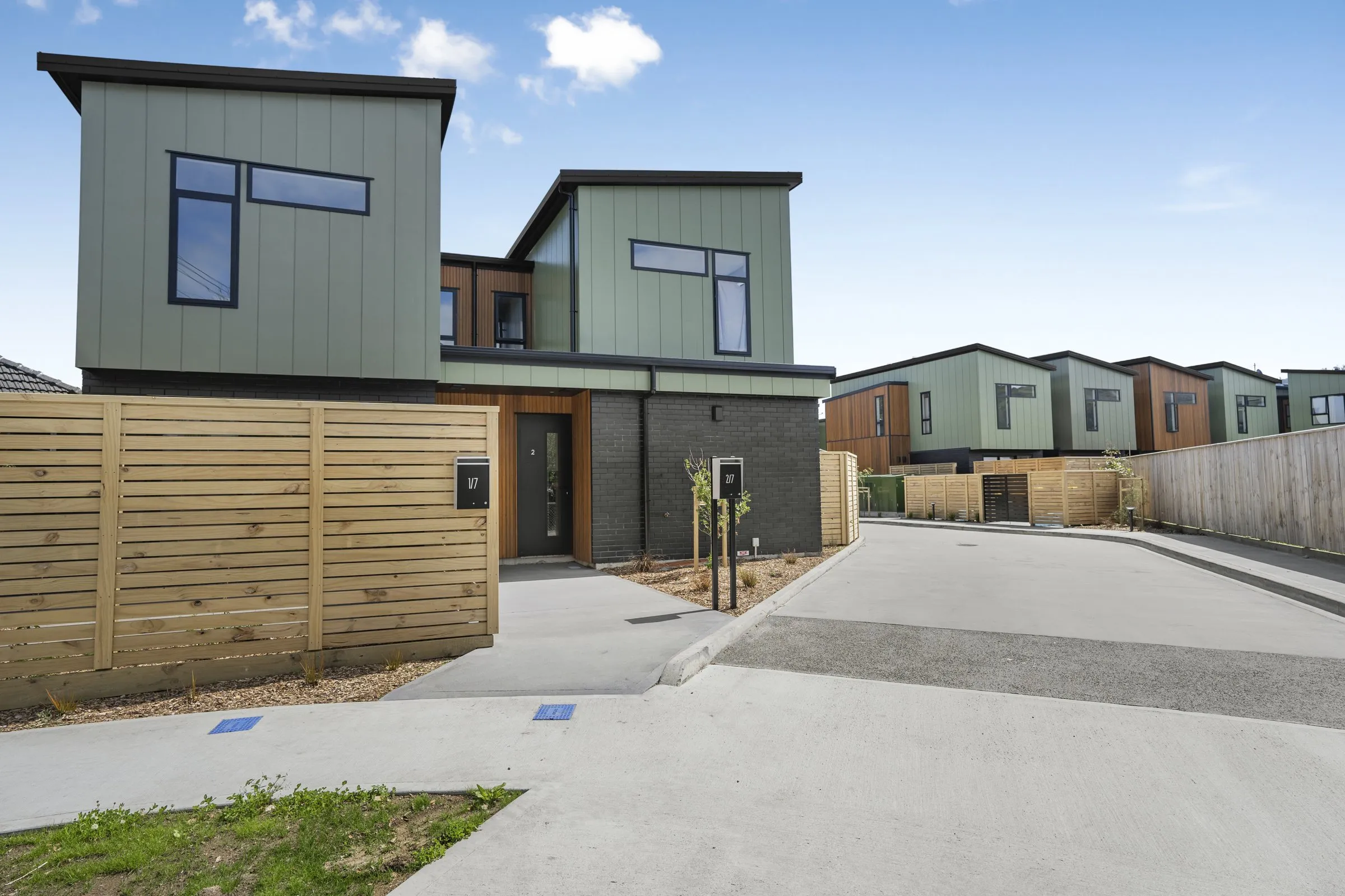 Townhouses with timber fencing and carparks