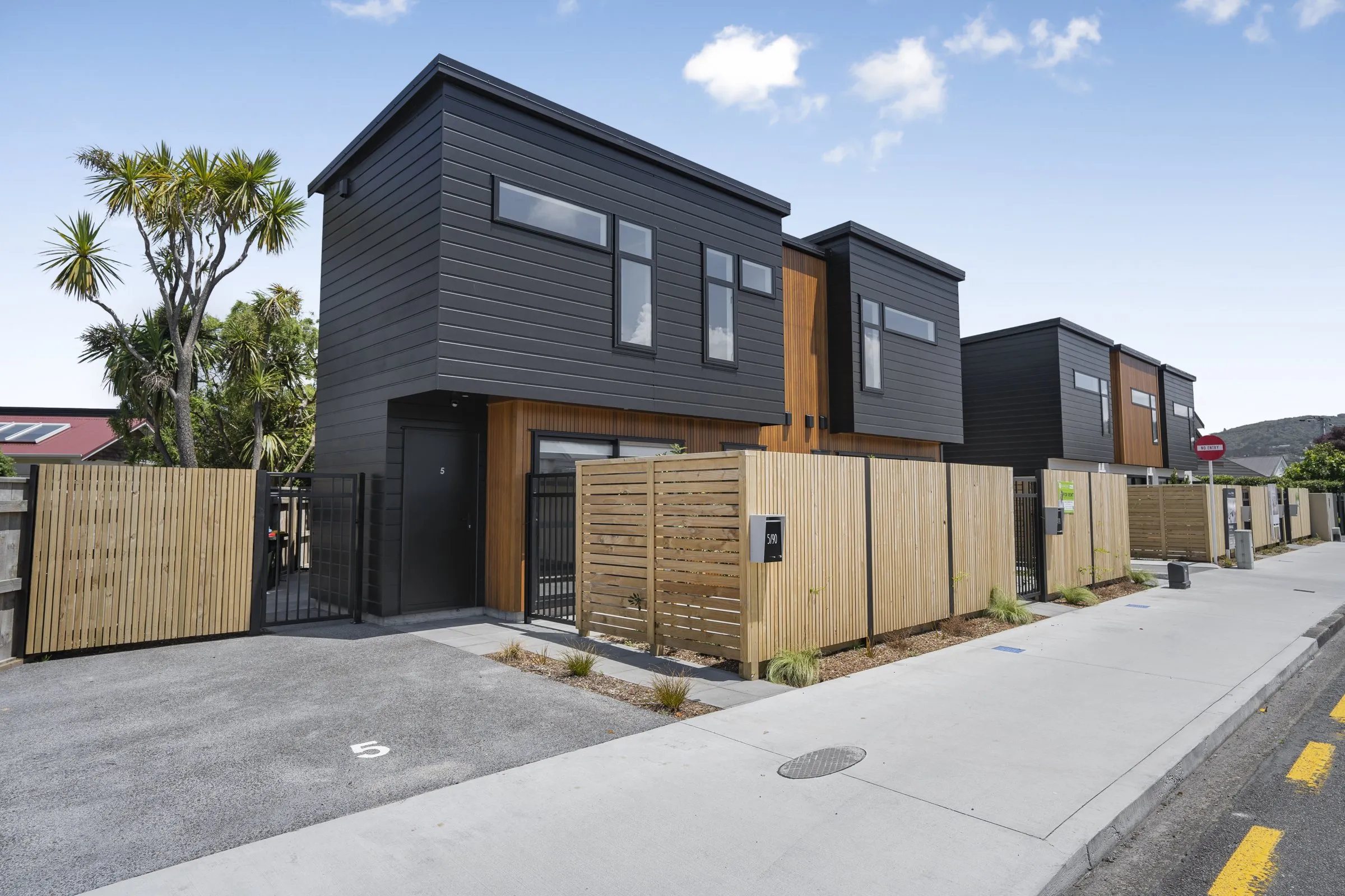Townhouses on the corner, with landscaping