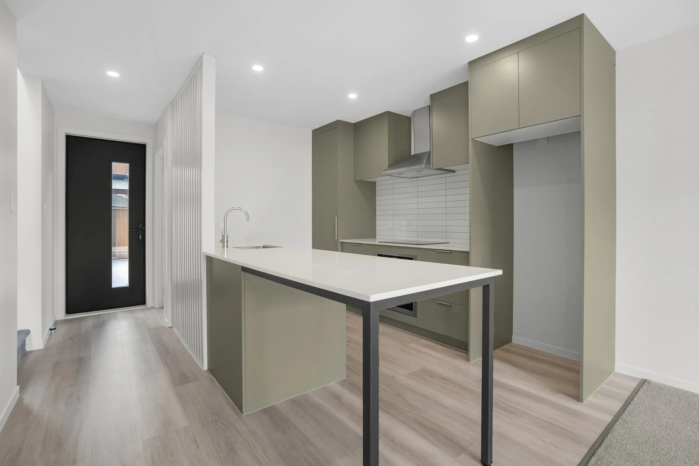 Kitchen with a hidden laundry