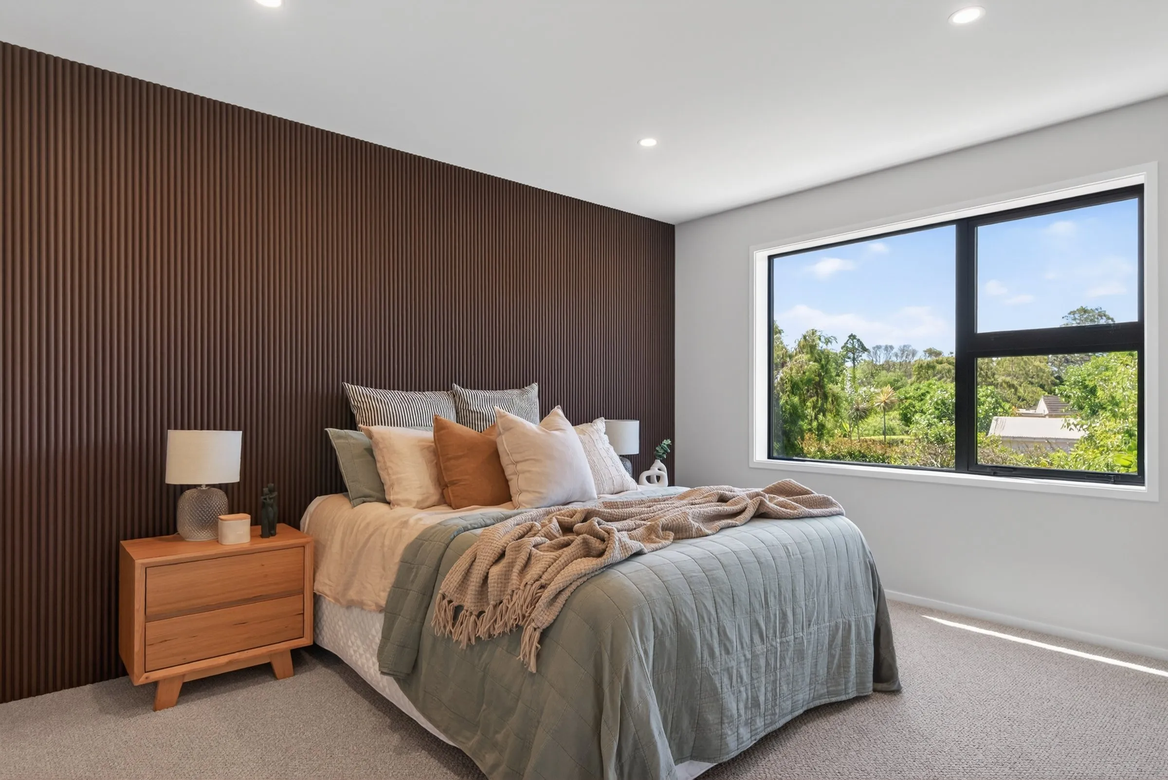 Bedroom with a timber feature wall