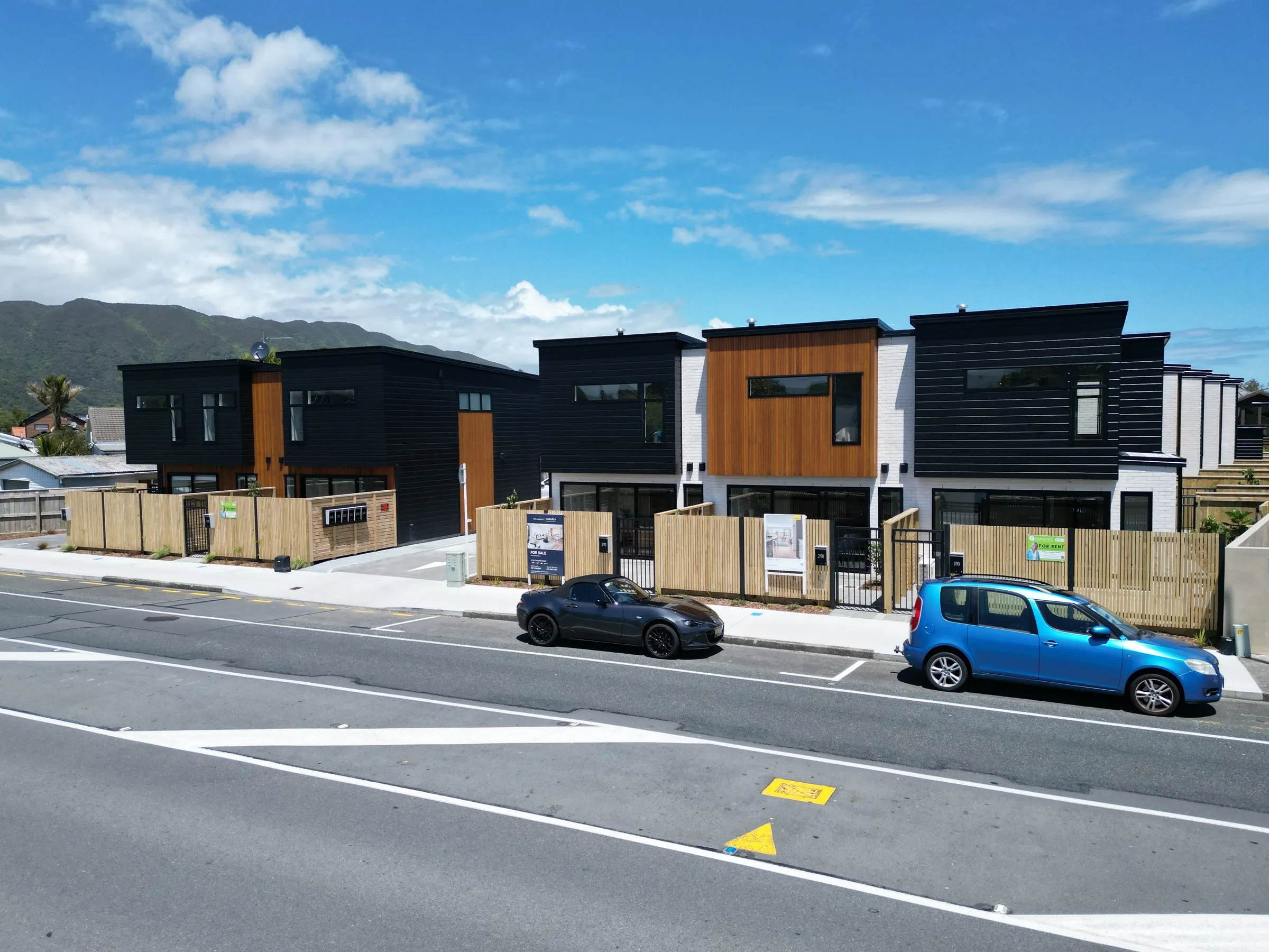 The street frontage with the hills behind