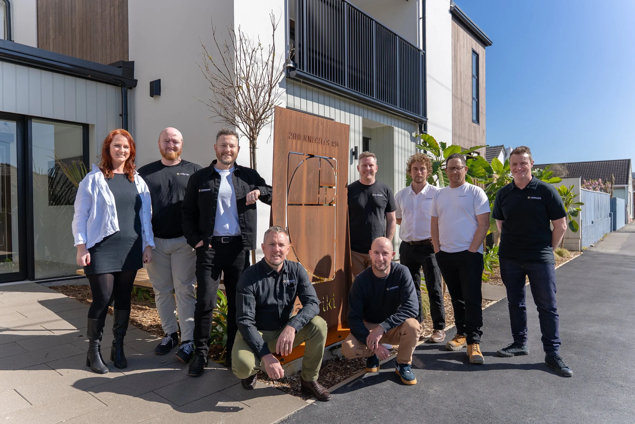 The Palmer & Cook team outside one of their developments